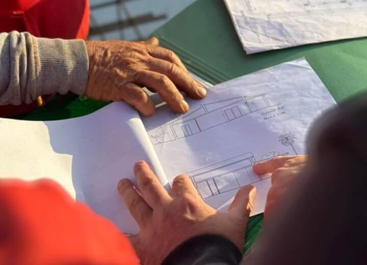Architects reviewing plans on site